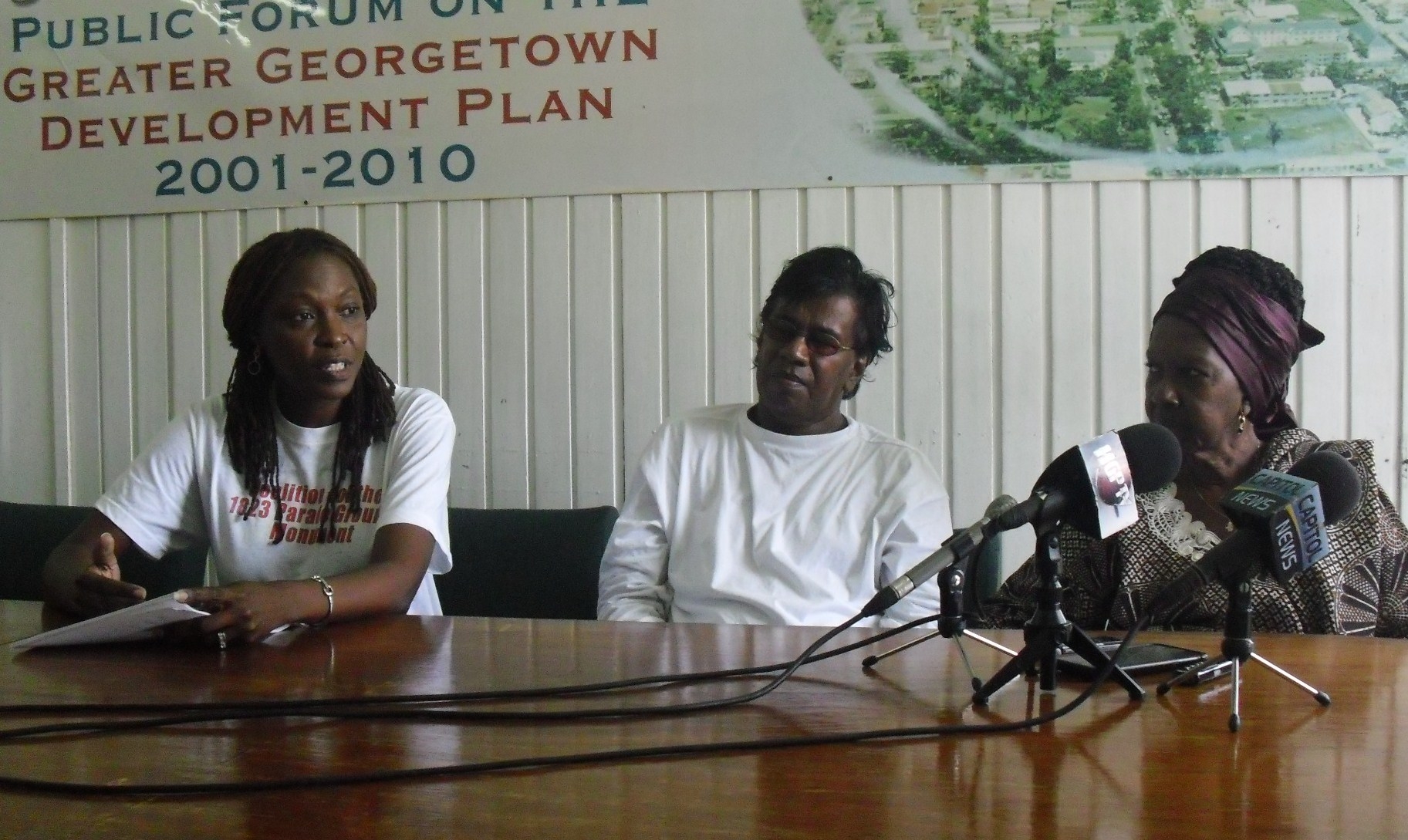 Group proceeding with Parade Ground monument to 1823 slave revolt