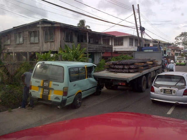 Minibus slams into steel-laden truck, driver seriously hurt