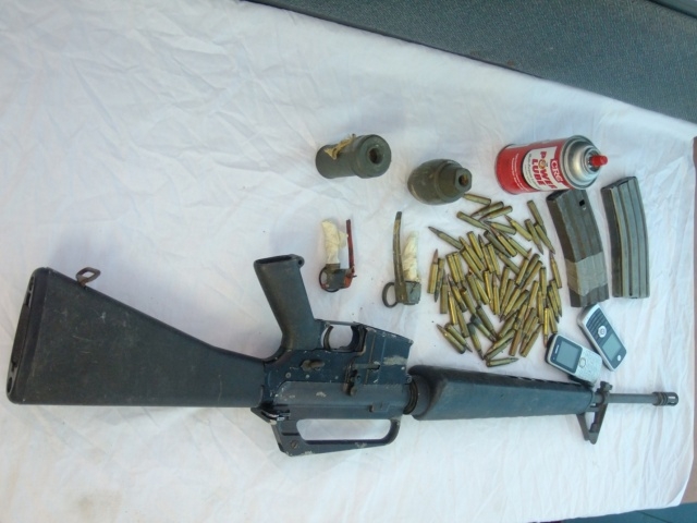 Two held with grenades, M16 rifle and ammo