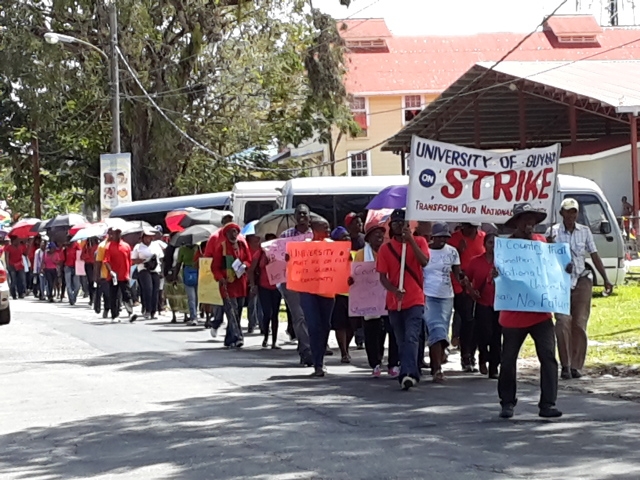 Defiant striking UG workers march to Georgetown
