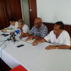 Second from left: President of GAWU, Komal Chand; NAACIE President, Kenneth Joseph and GAWU General Secretary, Seepaul Narine at the news conference held on January 25, 2016.