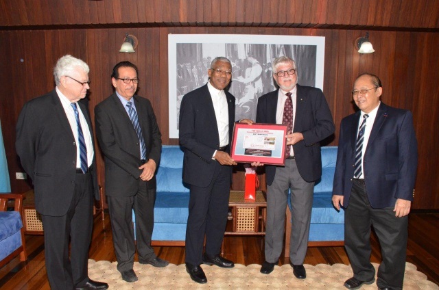 President receives book on history of cricket in Guyana from Hand-in-Hand