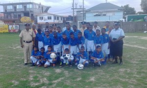 'F' Division Commander,Senior Superintendent Ravindradat Budhram and members of the Kaleidoscope Football Club in Bartica.