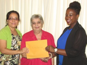 :  Representatives of the Step by Step Foundation for children with autism receives their organisation's support from CSR Manager Ayaana Jean-Baptiste (at right) 