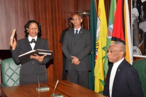 Justice Yonette Cummings-Edwards, Chief Justice (Ag) takes her Oath as a Member of the Judicial Service Commission, before His Excellency, President David Granger, at the Ministry of the Presidency Wednesday morning.