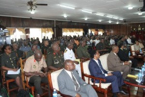 Top government ministers (front row) and officers of the Guyana Defence Force listen to the opening address by President David Granger at 2016 GDF Annual Officers' Conference.