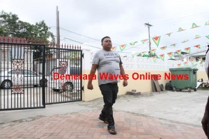 Barry Dataram entering the Public Service Department's compound at Vlissengen Road and D'Urban Street to appear before Inquiry Commissioner Brigadier Brewster Lovell.
