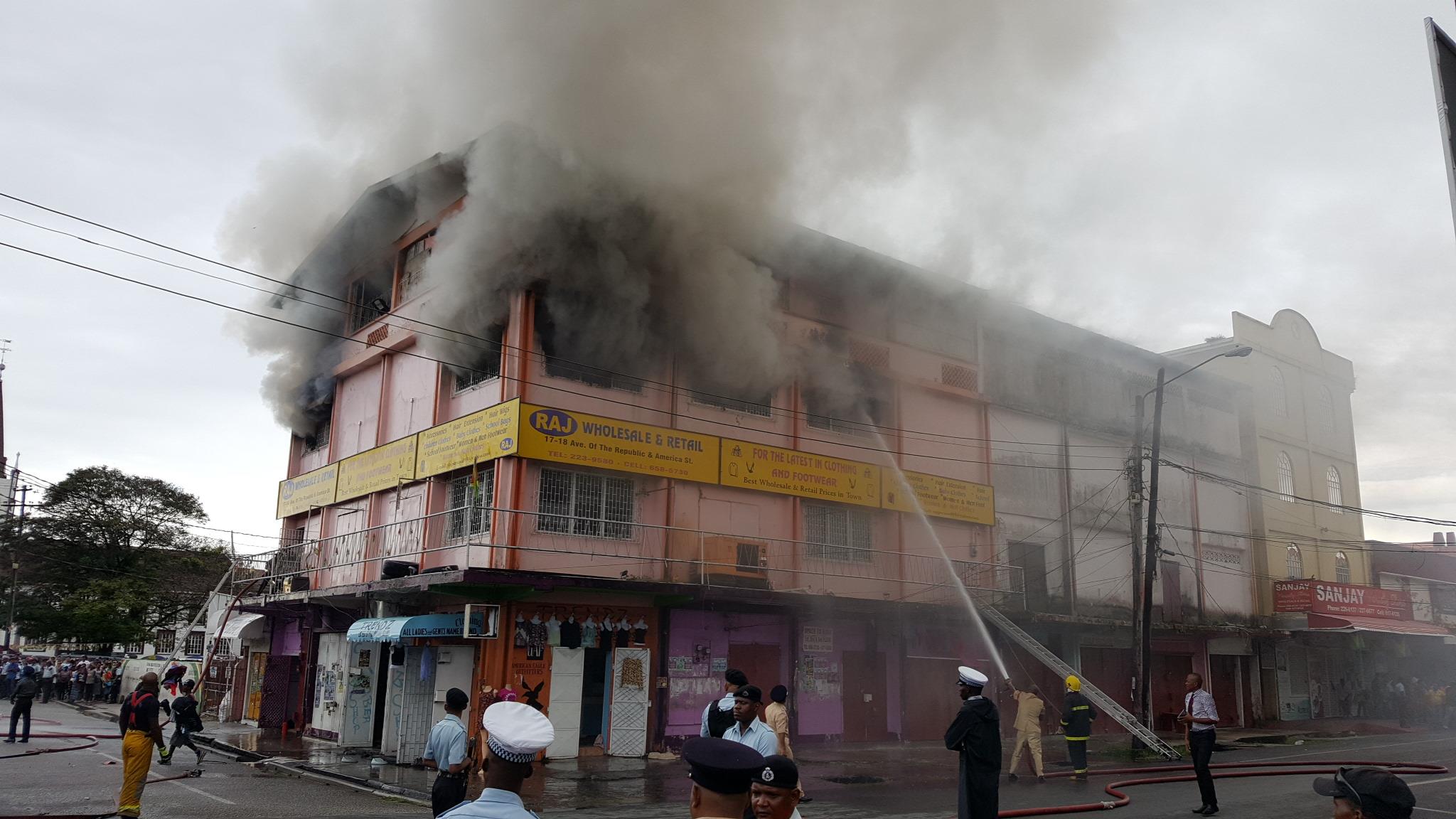 Fire partially guts city building, several stores dislocated