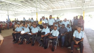 The few  members of the police force, who stood up, to indicate that they were taking notes during the Police Commissioner, David Ramnarine's address.