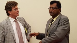 Britain's High Commissioner to Guyana, Gregg Quinn (left) and Minister of Public Security, Khemraj Ramjattan speaking recently at the American Embassy   before the launch of the US-funded Justice Education project.