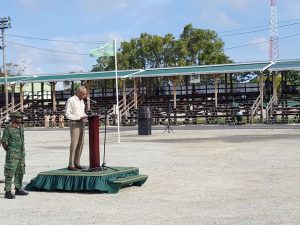 President David Granger addressing Guyana Defence Force soldiers at D'urban Park at the end of their route march on Saturday. At left, is GDF Chief-of-Staff, Brigadier George Lewis.