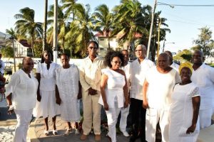 President David Granger with children and relatives of the late Claude Alphonso Merriman