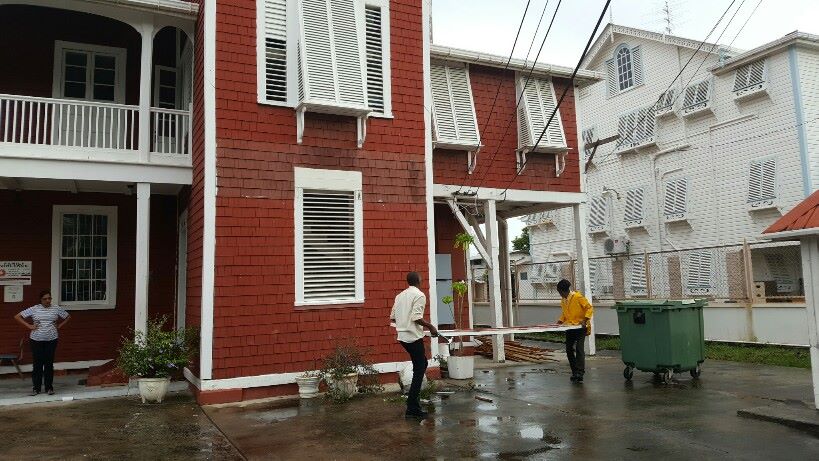 Legal action stalls removal of Cheddi Jagan Research Centre from Red House; Ministry of the Presidency workers rip down sign