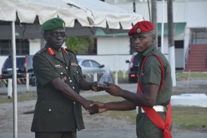 COS Brig George Lewis presents the Best Graduating Student award to Sergeant Lester Lewis