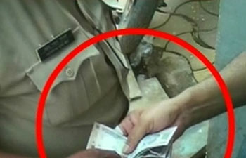 Police briber arrested in “sting operation”