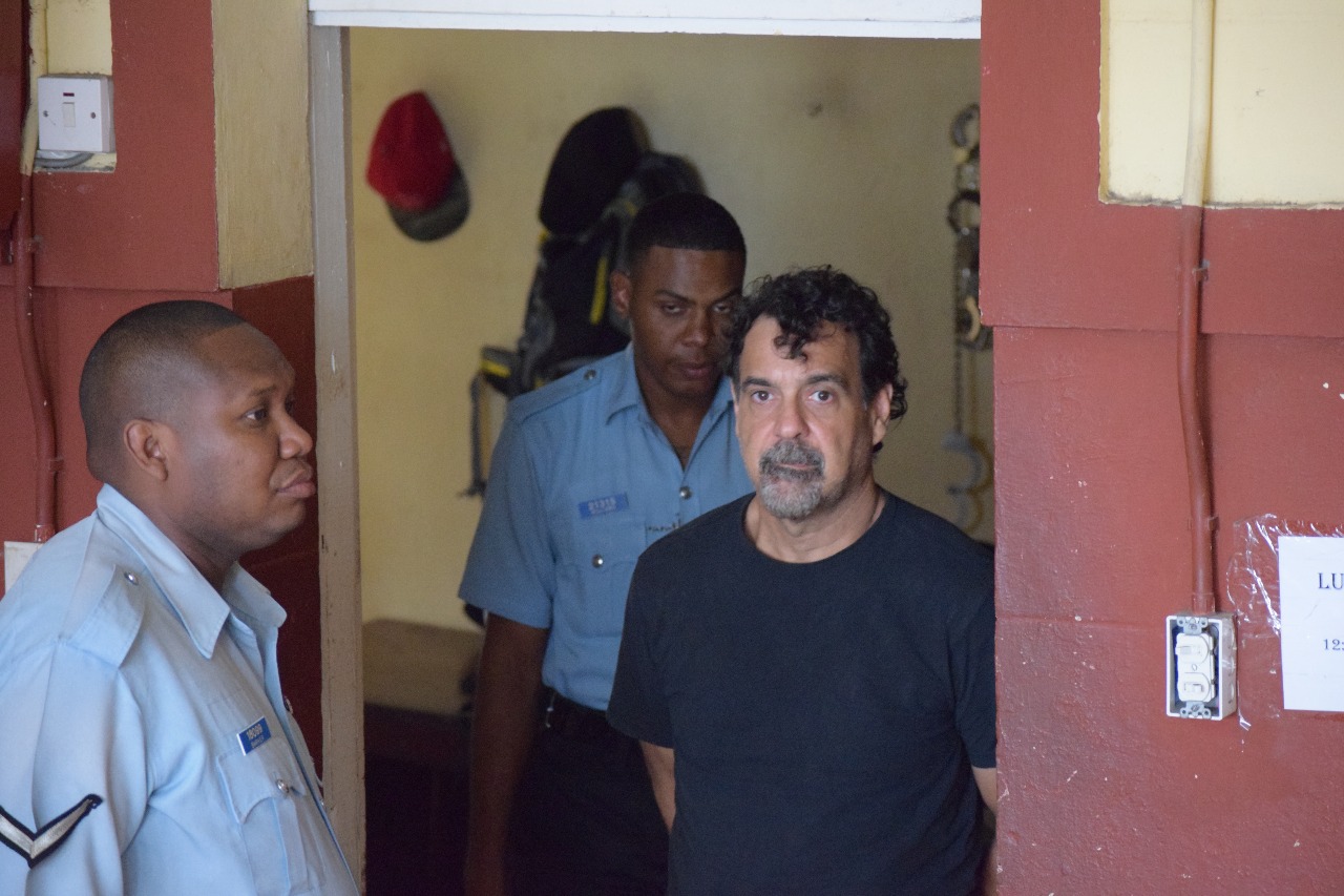 Canadian charged with attempting to steal raw gold from mining camp