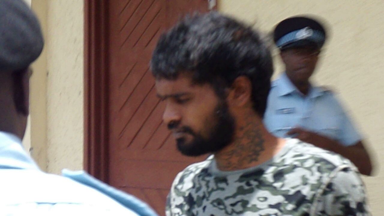 Man charged with wounding mother