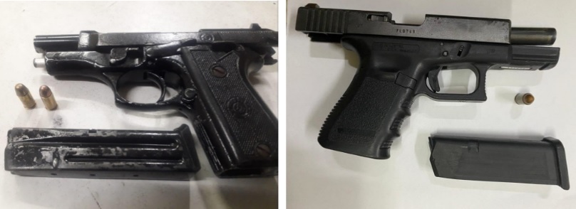 Four arrested for alleged possession of two guns