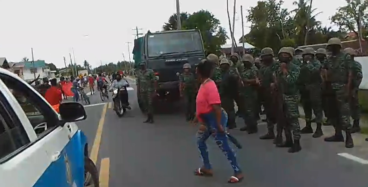Quindon Bacchus police killing: Protesters surge past riot police, soldiers without incident