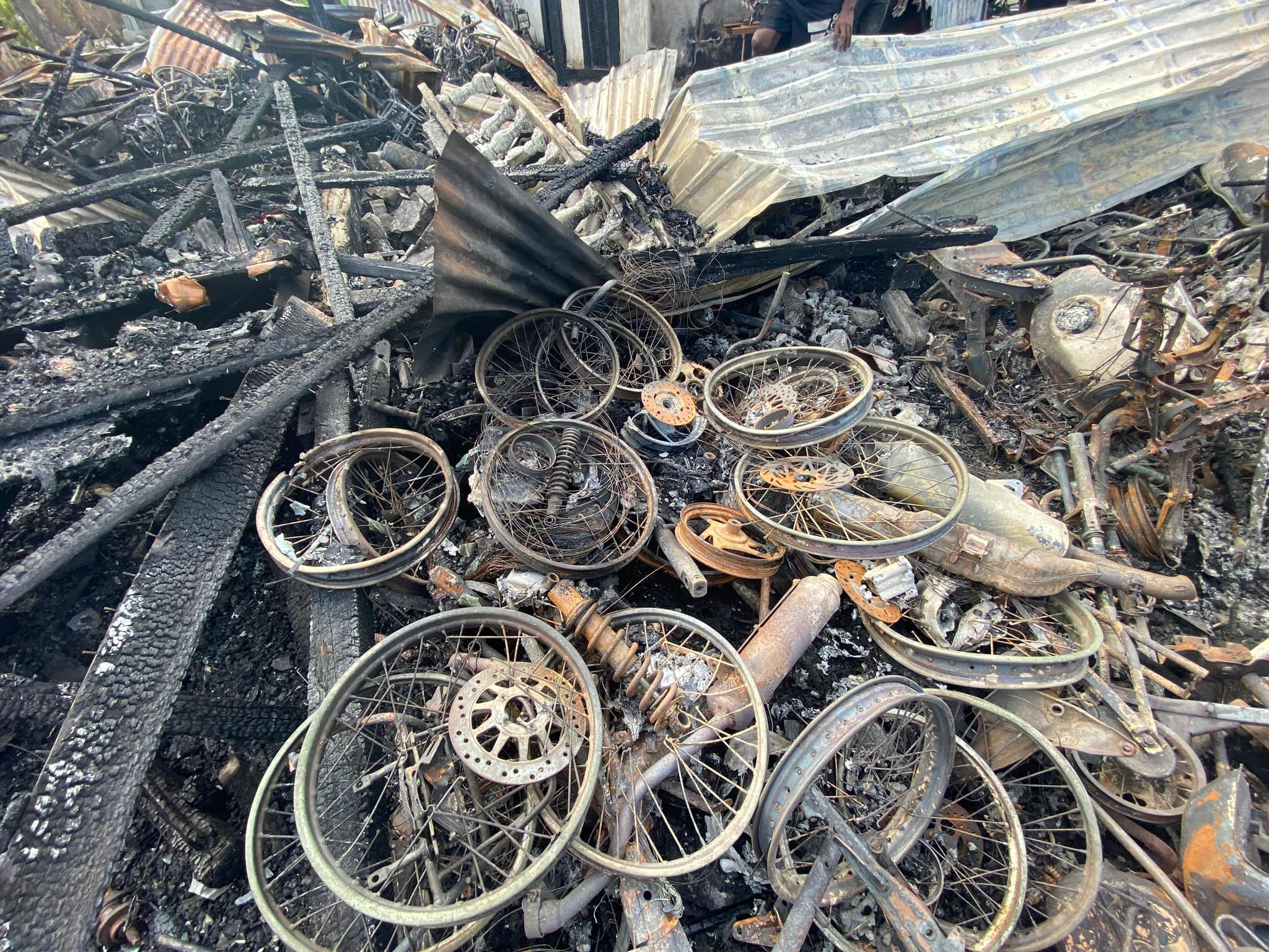 Suspected arson leaves 12 homeless, numerous motorcycles destroyed