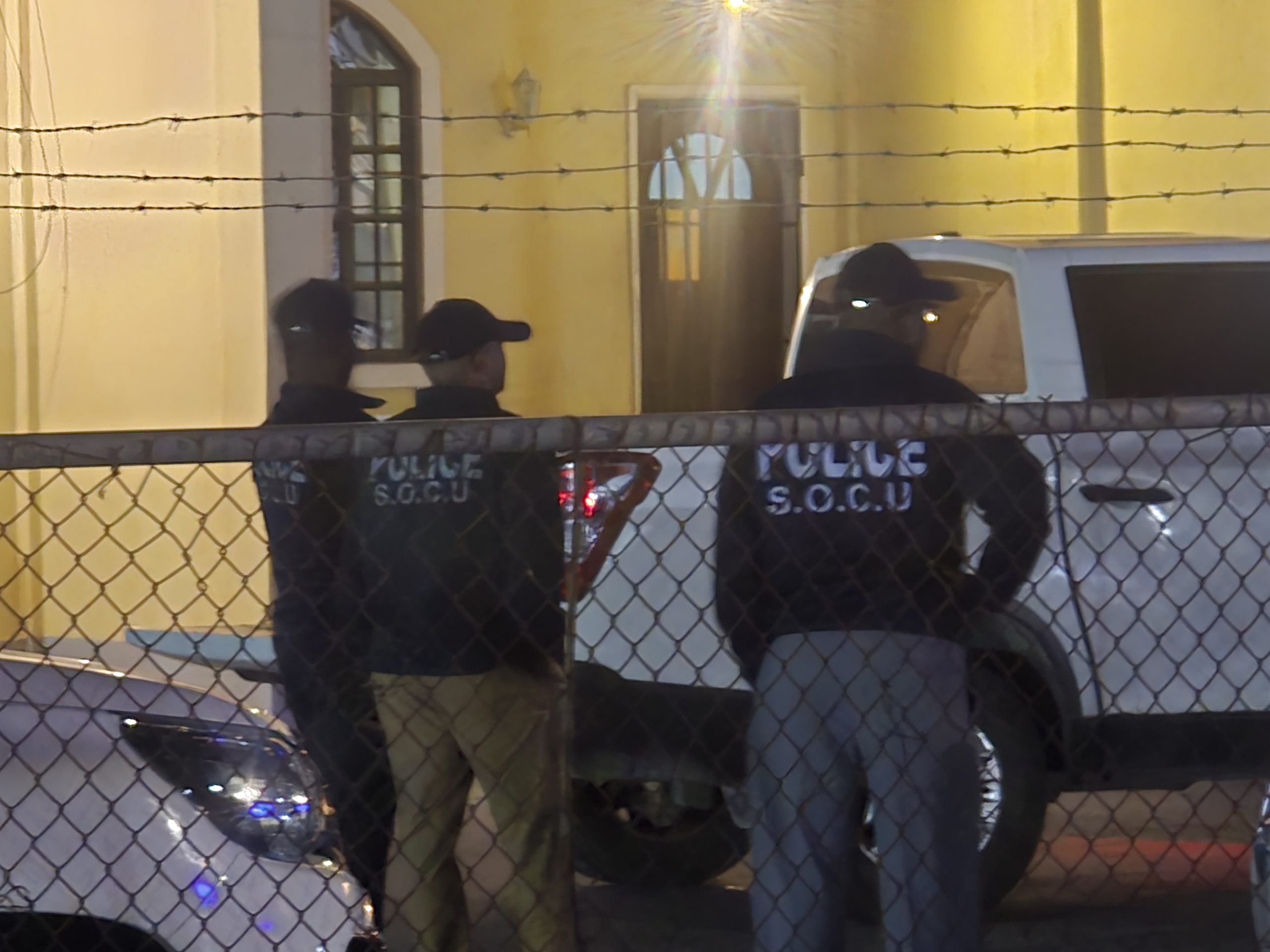 Heavily armed police surround police officer Brutus’ residence