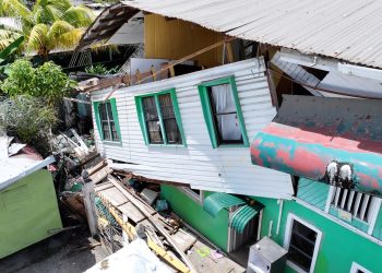 Realtor injured in massive explosion; wife smelled gas