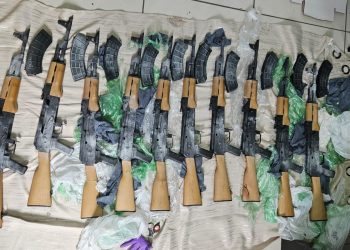 Ten AK-47 assault rifles found on Corentyne public road, one arrested, two vehicles held