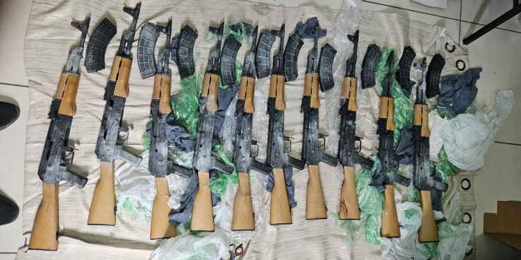10 AK-47 assault rifles found on Corentyne public road; one arrested, two vehicles held
