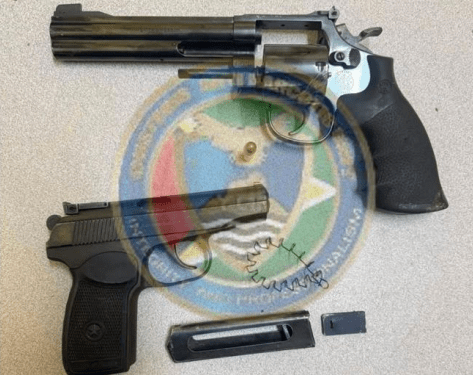 Russian-made handgun seized, two arrested